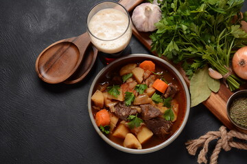 Irish stew made with beef, potatoes, carrots and herbs. Traditional St.Patrick's day dish, stewed in dark Guinness beer