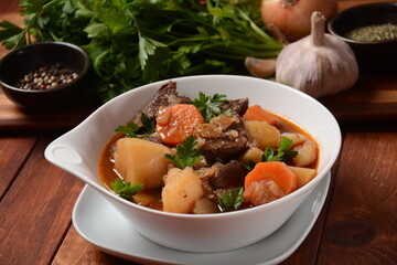 Irish stew made with beef, potatoes, carrots and herbs. Traditional St.Patrick's day dish, stewed in dark Guinness beer
