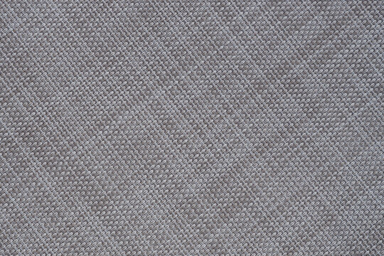 Beige mat of dry wicker fiber as texture, background.