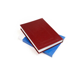 Stack of books in colour covers with white sheets isolated on a white background. Design element with clipping path