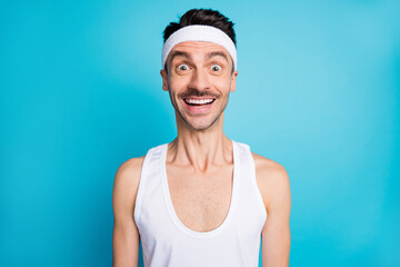Portrait of impressed sporty man open mouth scream wear white singlet tank-top isolated over blue color background