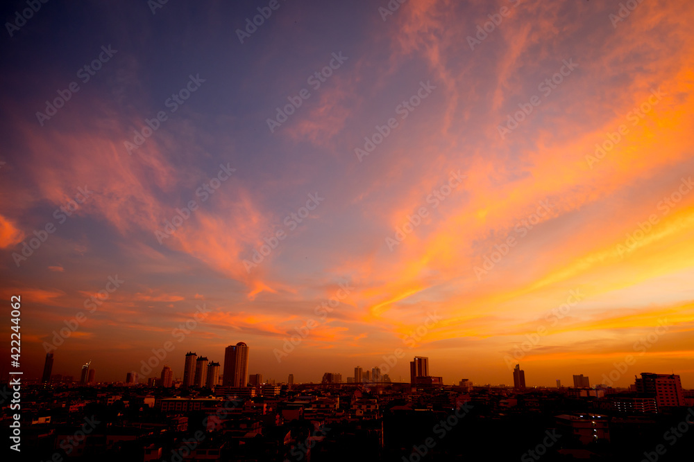 Wall mural Sunset sky with city in the shadow