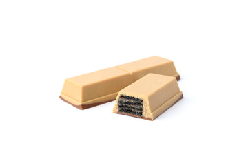 White chocolate bar with black waffle isolated on white background. Black wafer in white chocolate.