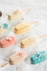 Fototapeta na wymiar Colored Ice Cream Bar on a Stick, pink, blue, yellow, wedding, brown 