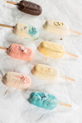 Obraz na płótnie Canvas Colored Ice Cream Bar on a Stick, pink, blue, yellow, wedding, brown 