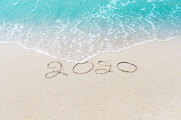 Happy New Year 2020 is coming concept sandy tropical ocean beach