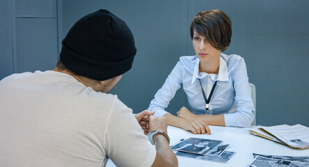 Portrait of a beautiful female detective who asked the question in a criminal