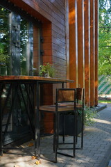 Two chairs next to the counter outside.