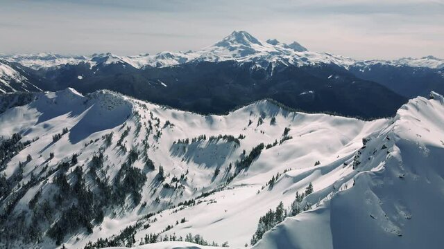 Mount Baker Aerial Background from Snowy Ridge of Fresh Powder