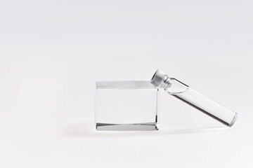 Glass ampoule with lid with beauty face serum treatment. Skin care cosmetic in transparent packaging  isolated on white background.  