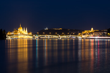 Night panorama of Budapest featuring Parliament building and Royal Palace