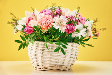 Bunch of fresh summer flowers on the yellow background