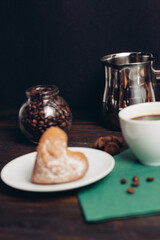 sweet biscuits plates green napkin wooden table coffee