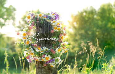 Summer concept. green natural background with wildflowers wreath. Summer Solstice Day, Midsummer...