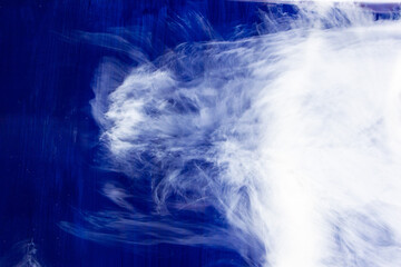 White smoke in dark deepness. Blue Alcoholic Ink. Cloud of ink. Abstract. White Stains. Sky Smearing. Water Delicate Liquid.