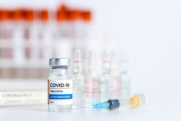 Coronavirus Covid-19 Vaccine vial glass bottles and syringe.