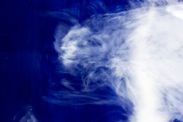 White smoke in dark deepness. Blue Alcoholic Ink. Cloud of ink. Abstract. White Stains. Sky Smearing. Water Delicate Liquid.