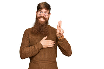 Young irish redhead man wearing casual clothes and glasses smiling swearing with hand on chest and...