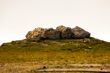A pile of stones at the edge of a mountain
