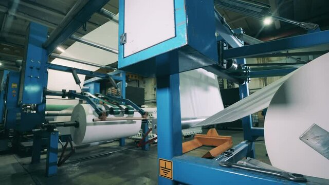 Large paper converting machine at a paper manufacturing plant