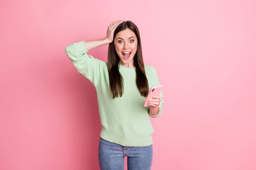 Portrait of impressed lady arm on head open mouth unexpected subscribe isolated on pink color background