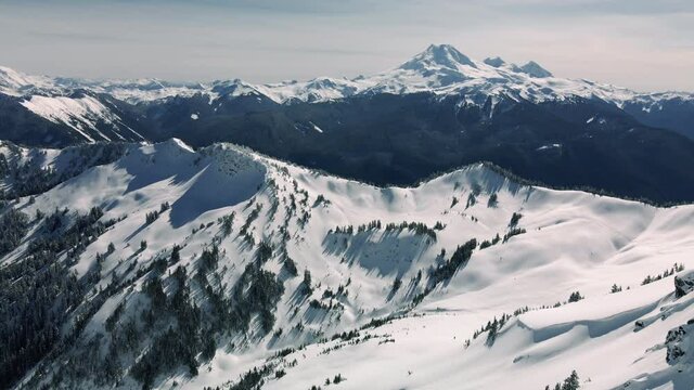 Stunning Aerial View of Mount Baker from Across Snowy Valley