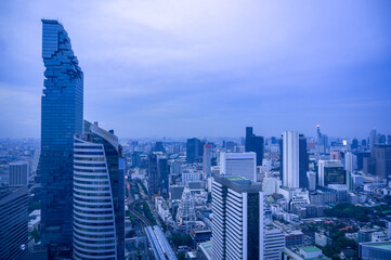 Aerial view of Bangkok city at twilight sunset in Thailand. cityscape of Modern buildings and urban architecture