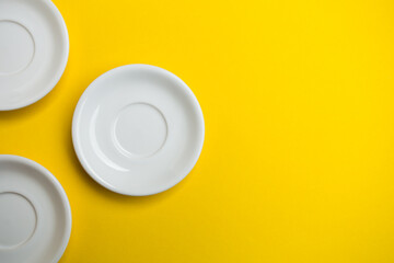 White plate on a Background yellow.