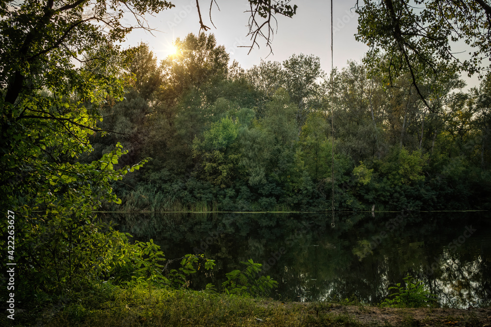 Wall mural Picturesque spring sunset over the river