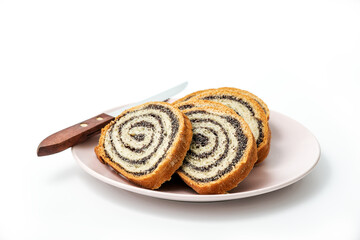 Homemade poppy seeds pie isolated on white background, dessert and decoration for Christmas, rolled up traditional poppy pie