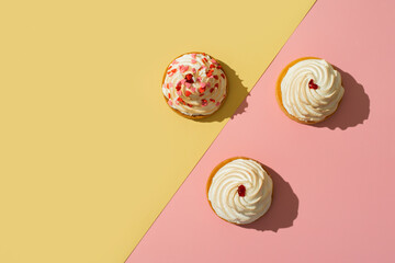 Cupcake with cream and decorative hearts on mothers day or valentines