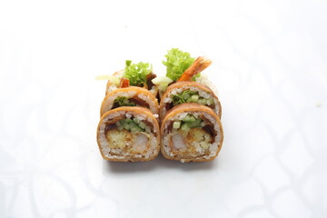 6 piece sushi set. Tempura maki rolls with shrimp, cucumber and pickled radish, isolated on a white background. Japanese cuisine delicacy.