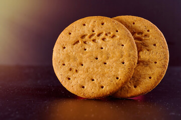 Flour cookies on a dark background. Cracker. Macro effect photo.