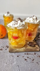 Sweet jelly and fruits dessert in jars - 422265800
