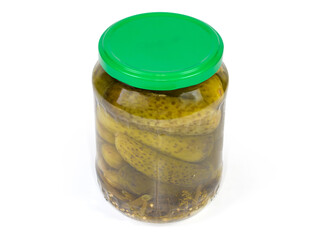 Canned cucumbers in glass jar with closed lid