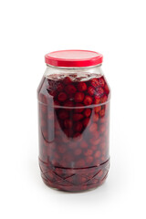 Cherry jam with whole berries in glass jar