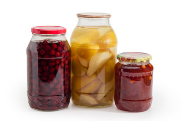 Fototapeta na wymiar Canned pears and cherry, apricot jam in glass jars