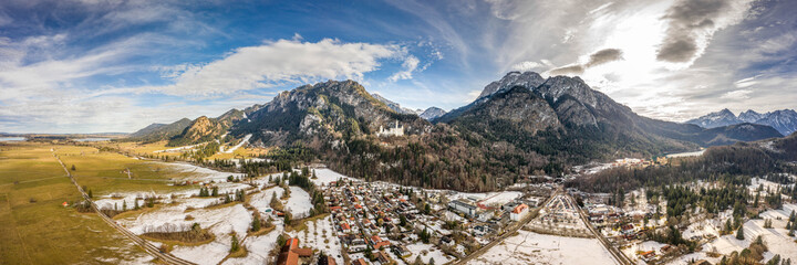 Aerial panorama drone shot of Hohenschwangau in Fussen with view of Neuschwanstein castle in...