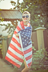 Woman with american flag outdoors