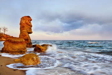 Rocks of interesting shape, similar to an idol from Easter Island on the seashore. Black Sea.