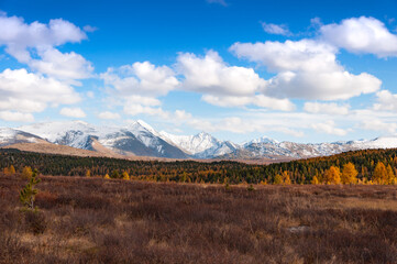 Scenic view over snow capped mountain range. Altai autumn landscape, Russia