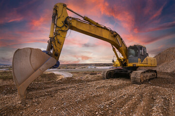 Excavator at the end of a working day in a construction site