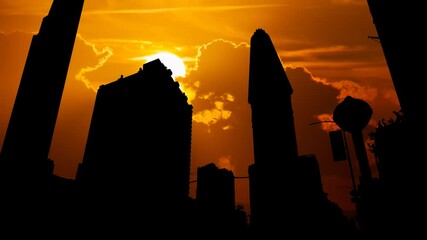 New York City Skyline: Flatiron building in Manhattan, Time Lapse at Sunset with Red Sun and Fiery Sky
