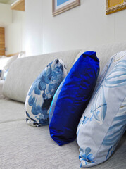 Modern interior design balcony or verandah cabin stateroom with double queen bed, couch, vanity...