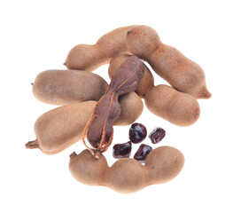 Tamarind pods (Tamarindus indica fruits), pile of, open pod,  pulp,isolated on white background.
