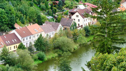 Fototapeta na wymiar Houses lined up next to a river in Tabor, Czech Republic