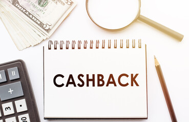 CASHBACK - text written on a notebook with office background.