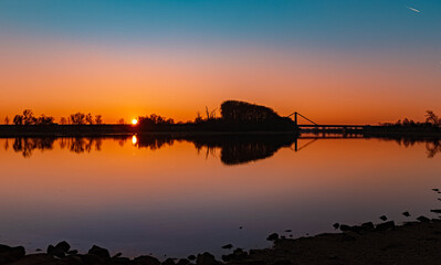 Beautiful sunset with reflections near Metten, Danube, Bavaria, Germany