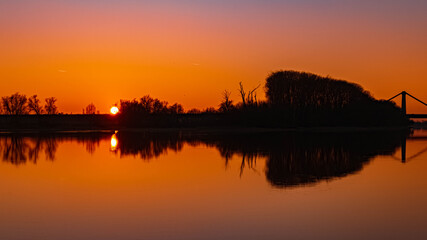 Beautiful sunset with reflections near Metten, Danube, Bavaria, Germany
