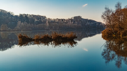 Beautiful winter view with reflections at Zeholfing, Isar, Bavaria, Germany